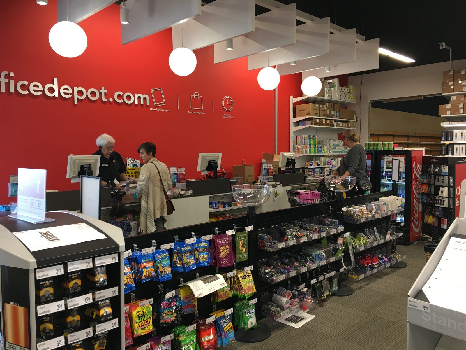 Impulse buy displays mounted on stanchions at Office Depot