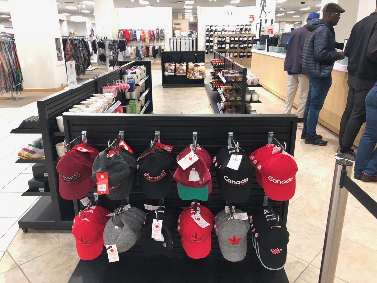 Apparel and accessories merchandising display in retail queue line