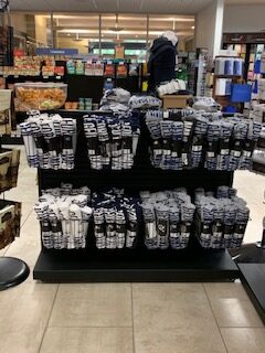 College bookstore impulse merchandising installation with stanchions
