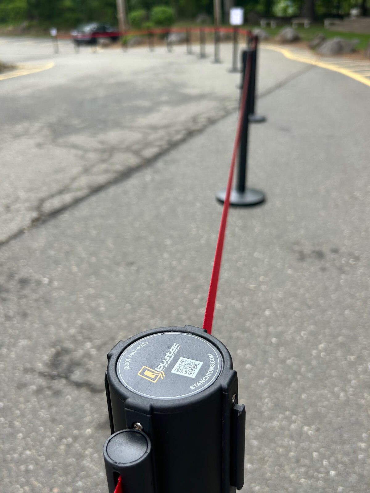 Close-up of custom printed retractable belt stanchion at Don Bosco