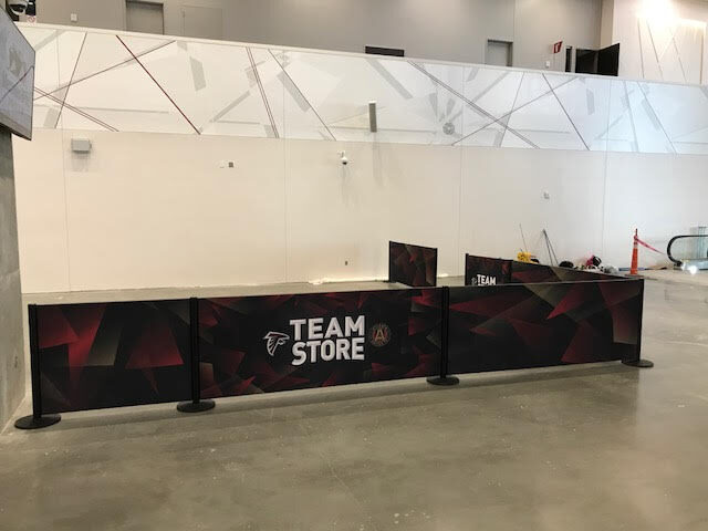 Stretch fabric branded counter wrap at a stadium team store
